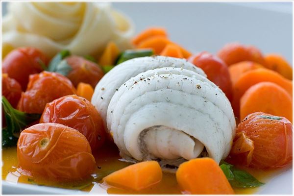 Steamed plaice with carrots in orange juice